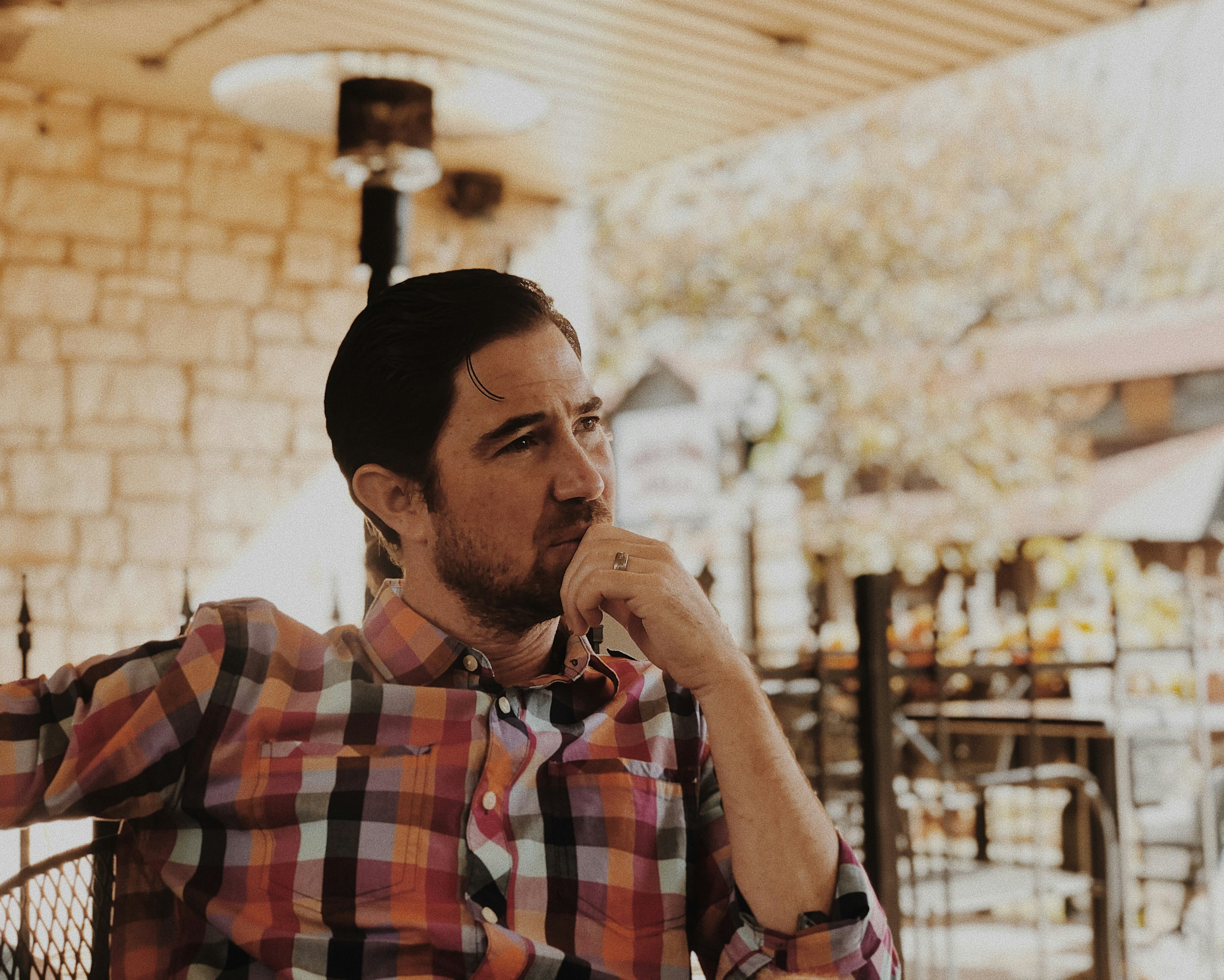 A middle-aged man pauses in thought