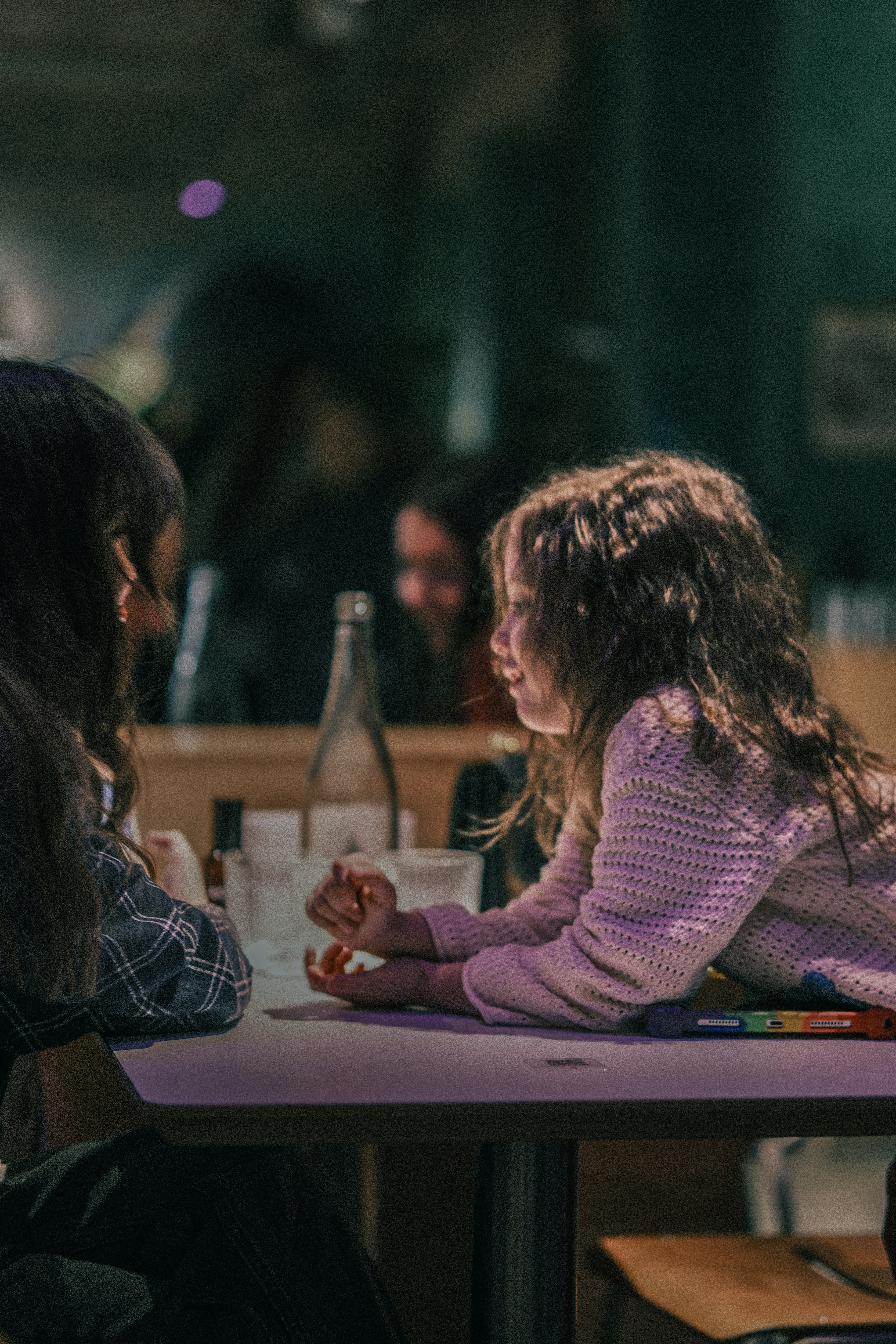 Two women in conversation at a table